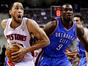 Detroit Pistons forward Tayshaun Prince, left, drives on Oklahoma City Thunder forward Serge Ibaka in the first half of an NBA game in Auburn Hills, Mich., Monday, Nov. 12, 2012. (AP Photo/Paul Sancya)