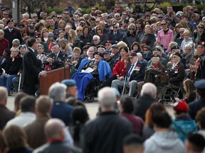 A large crowd listens to MP Brian Masse speak during the 2012 Remembrance Day ceremony at the Cenotaph in downtown Windsor, Sunday, Nov. 11, 2012.  (DAX MELMER/The Windsor Star)