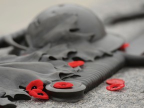 Remembrance Day poppies lie on the Tomb of the Unknown Soldier at the National War memorial, on Friday Nov.9, 2012. (THE CANADIAN PRESS/Adrian Wyld)