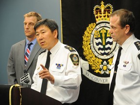 Chief Constable Jim Chu ( C ), flanked by Sergeant Dale Weidman ( L ) and Inspector Les Yeo, speaks at Vancouver Police news conference to update progress on charges in Stanley Cup riot, in Vancouver on Wednesday, August 17, 2011. ( Glenn Baglo / PNG )