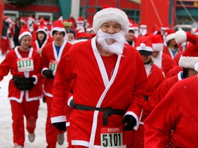 Files: More than 250  runners and walkers were dressed as Santa Claus as they competed in the Run Santa Run race raising funds for the Third Academy in Calgary on  December 18, 2010. (Postmedia News files)