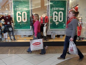 The windows of a clothing store at the Devonshire Mall try to entice customers with Black Friday deals. (Tyler Brownbridge / The Windsor Star)