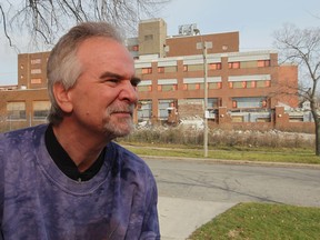 Andrew Mergl, a 45 year-old employee of Caesars Windsor has been living across from the abandoned Grace Hospital site for seven years and watching his neighbourhood, one of the fastest shrinking in the city. (JASON KRYK/ The Windsor Star)
