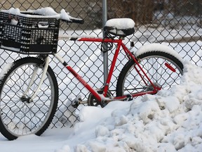 A snow covered bike sits along a fence in Windsor, ON. Dec. 13, 2010. after the region's first real taste of winter. (DAN JANISSE/The Windsor Star)