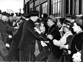 FORD-Nov 3 1945- Windsor Police try to push its way through the picket line in front of the Ford Motor Company office entrance. The Windsor Star-FILE