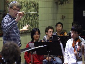 Conductor Peter Wiebe, left, rehearses with the Windsor Symphony Orchestra Youth Orchestra at Place Concorde, Saturday, Feb. 18, 2012.  (DAX MELMER / The Windsor Star)