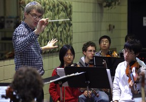 Conductor Peter Wiebe, left, rehearses with the Windsor Symphony Orchestra Youth Orchestra at Place Concorde, Saturday, Feb. 18, 2012.  (DAX MELMER / The Windsor Star)