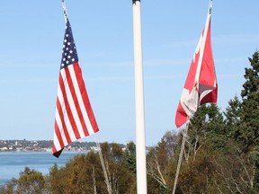 Canadian and U.S. flags. (Telegraph-Journal)