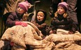Elli Roland, 8, (L) Nate Lawrence, 3, and Lilli Bontorin, 6, take in the sights Friday, Nov. 30, 2012, during the Tecumseh Santa Claus Parade.