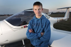 Andrea Beltramello, 16, took his first solo flight Thursday, Nov. 29, 2012. The young pilot poses at the Journey Air pilot training facility in Windsor, Ont. (DAN JANISSE/The Windsor Star)