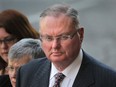 Murray Bryant, a business professor at the University of Western Ontario, leaves the traffic court building in Windsor, Ont. on Nov .21, 2012. Bryant pleaded guilty to careless driving for a collision that killed tow truck driver Paul Rocheleau earlier this year. (Dan Janisse / The Windsor Star)