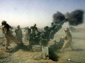 A Canadian artillery crew opens fire at insurgents who ambushed Canadian soldiers in the violence-plagued Zhari district in southern Afghanistan on August 7, 2008. Six Canadians were wounded in the attack, none seriously.