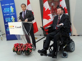 In this file photo, Yves Desjardins-Sicilano, chief legal and corporate affairs officer and corporate secretary of VIA Rail, and Minister of State Steven Fletcher (right) speak during the grand opening of the new VIA Rail station in WIndsor on Friday, November 16, 2012.                (TYLER BROWNBRIDGE / The Windsor Star)