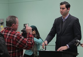 City councillor Al Maghnieh listens as ward 10 resident Richard Dawson tells him to step down from his position during a ward meeting Tuesday, Nov. 27, 2012, at the Nikola Budimir Windsor Public Library in Windsor, Ont. (DAN JANISSE/The Windsor Star)