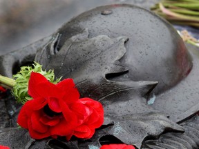 In this file photo, flags and poppies are placed on the tomb of the Unknown Soldier following Vimy Ridge ceremonies held April 9, 2010, at the National War Memorial. In honour of the passing of the last Canadian veteran of the First World War, John Babcock, ceremonies were held in Ottawa on the anniversary of the Battle of Vimy Ridge. (Postmedia News files)