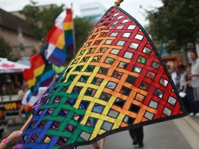 Rainbow flags accentuate the annual Windsor Pride parade celebrating lesbian, gay, bisexual and transgendered (LGBT) community members. Photographed August 2012 in downtown Windsor, Ont. (Dax Melmer / The Windsor Star)