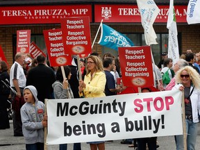 OSSTF occasional teachers barganing unit president Scott Hunt addresses hundreds from six different bargaining units and other supporters during a Public Education Rally at Teresa Piruzza's office on Dougall Avenue Friday afternoon, June 1, 2012.  (NICK BRANCACCIO/The Windsor Star)