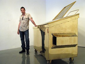 Windsor artist Zeke Moores stands beside his sculpture entitled Dumpster (Windsor Star files)