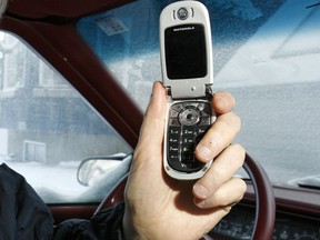 Driving and talking on cellphone. (Postmedia News files)