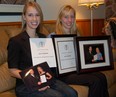 Evan Puddy, left, and Angela Robertson display their Duke of Edinburgh awards, which they received from His Royal Highness Prince Edward the Earl of Wessex at a ceremony in Toronto in September. (The Windsor Star/ Julie Kotsis)