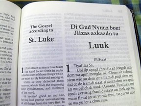 In this Dec. 3, 2012 photo, the first page of the Gospel according to St. Luke, or the 'Di Gud Nyuuz bout Jiizas azkaadn tu Luuk,' is shown at the office of the Bible Society of the West Indies in Kingston, Jamaica. After years of translation from the original Greek, the Bible Society is releasing in Jamaica print and audio CD versions of the first patois translation of the New Testament, or "Di Jamiekan Nyuu Testiment." For patois expert Hubert Devonish, a linguist who is co-ordinator of the Jamaican Language Unit at the University of the West Indies, the Bible translation is a big step toward getting the state to eventually embrace the creole language created by slaves. (AP Photo/David McFadden)