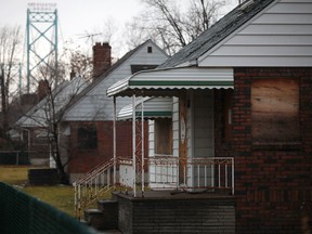 A boarded up house on the 600 block of Indian Road in West Windsor is pictured Sunday, Dec. 16, 2012. City council is expected Monday to defer a new application from the Ambassador Bridge to demolish properties it owns in Sandwich
 (DAX MELMER/The Windsor Star)