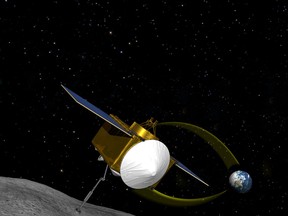 This is a March 2010 artist's concept of the OSIRIS-REx spacecraft taking a sample from asteroid 1999 RQ36. NASA scientists want to lasso an asteroid the size of two double-decker buses and turn it into a space station orbiting the moon.
The plan is among those the agency is putting before the White House’s Office of Science and Technology.