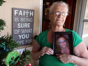 Olive Antle, 72, is anxious to see what plans can be made to meet with her long-lost daughter Mary Elizabeth who was put up for adoption more than 50 years ago. Antle holds a recent photograph of her daughter, now named Colleen.  (NICK BRANCACCIO/The Windsor Star)