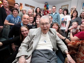 Robert O'Brien, centre, celebrates his 96th birthday with his family at his daughter's house on Drouillard Road Saturday, Dec. 29, 2012. The O'Briens say Robert was never acknowledged as the first New Year baby of 1917. (KRISTIE PEARCE/ The Windsor Star)