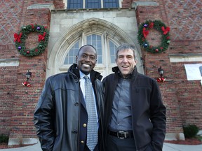 Harvey Carey, left, senior pastor at the Citadel of Faith Convenant Church in Detroit, Mich., stands Tuesday, Dec. 18, 2012, at the church with Brad Watson, senior pastor with the Lakeshore St. Andrews Presbyterian Church in Lakeshore. The two met at a conference and have become close friends.  (DAN JANISSE/The Windsor Star)