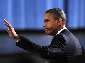 U.S. President Barack Obama waves as he arrives at a memorial service for victims of the Sandy Hook Elementary School shooting at Newtown High School in Newtown, Connecticut, U.S., on Sunday, Dec. 16, 2012. Obama arrived in Newtown, Connecticut, two days after the tragedy and as authorities were still trying to piece together a motive for the second-deadliest mass shooting in the U.S. Photographer: Olivier Douliery/Pool via Bloomberg