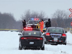Chatham-Kent police investigate a fatal collision Saturday, Dec. 30, 2012, between a Via Rail train and pickup truck at Zone Road 6 and Fairfield Line in Zone Township, near Thamesville. (DAX MELMER / The Windsor Star)
