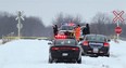 Chatham-Kent police investigate a fatal collision Saturday, Dec. 30, 2012, between a Via Rail train and pickup truck at Zone Road 6 and Fairfield Line in Zone Township, near Thamesville. (DAX MELMER / The Windsor Star)