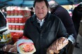 Past president of the Canadian Italian Business Professional Association, Carl Grossi,  prepares to give out turkey dinners at the CIBPA Christmas turkey donation outside the CIBPA Centre, Saturday, Dec. 22, 2012.  (DAX MELMER/The Windsor Star)