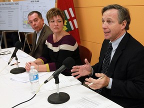Dave Cooke, left, Teresa Piruzza and Tom Porter take part in a news conference at St. Clair College in Windsor on Friday, Dec. 7, 2012. The three were part of a task force that looked at building a single hospital in Windsor to replace the two current aging hospitals.  (TYLER BROWNBRIDGE/The Windsor Star)