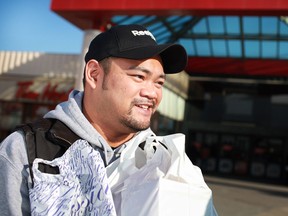 Christian Cruz, 37, gets some last minute Christmas shopping done at Devonshire Mall, Sunday, Dec. 23, 2012.  (DAX MELMER/The Windsor Star)