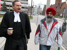Windsor lawyer Pat Ducharme, left, with Karamjit Singh Grewal leaving Superior Court of Justice in Windsor Monday December 10, 2012.  (NICK BRANCACCIO/The Windsor Star)