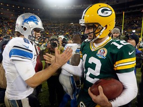 Green Bay quarterback Aaron Rodgers, right, shakes hands with Detroit Lions quarterback Matthew Stafford after the Packers' 27-20 win at Lambeau Field Sunday.   (AP Photo/Mike Roemer)