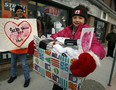 In this file photo, Sarah Lewis, 9, hands out new packages of socks to area homeless and needy families at Street Help/Unit 7 drop in centre on Wyandotte Street East Friday December 11, 2009.  (Windsor Star files)