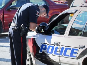 File photo of a Windsor Police officer filling out a report. (Windsor Star files)