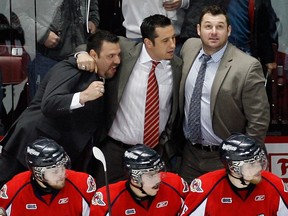 Windsor coaches Bob Jones, from left, Bob Boughner and D.J. Smith celebrate after winning Game 7 against Kitchener in 2010. (NICK BRANCACCIO/The Windsor Star)