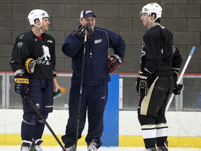 Oshawa Generals head coach D.J. Smith, centre,  talks with Sabres forward Steve Ott, left, and James Neal from the Pittsburgh Penguins during a practice at the WFCU Centre Friday. (JASON KRYK/The Windsor Star)