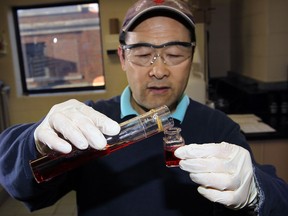 Licensed water operator David Xu tests the level of fluoride in a sample of water at WUC Albert Weeks plant on Wyandotte Street East December 13, 2012. (NICK BRANCACCIO/The Windsor Star)