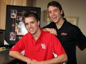 Aaron Ekblad, left, and brother Darien take a break during the 2011 season at their home in Belle River. (NICK BRANCACCIO/The Windsor Star)