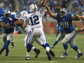 Andrew Luck #12 of the Indianapolis Colts gets pressure from Ndamukong Suh #90 and Nick Fairley #98 of the Detroit Lions at Ford Field on December 2, 2012 in Detroit, Michigan. The Colts won 35-33  (Photo by Dave Reginek/Getty Images)
