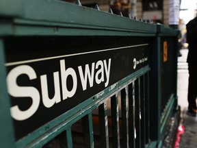 A man walks past a subway stop in Manhattan two days after a man was pushed to his death in front of a train on December 5, 2012 in New York City. (Photo by Spencer Platt/Getty Images)