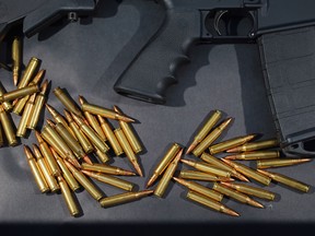 A Rock River Arms AR-15 rifle is seen with ammunition on Dec.18, 2012. The gun is similar in style to the Bushmaster AR-15 rifle that was used during a massacre at an elementary school in Newtown, Connecticut. (Joe Raedle/Getty Images)