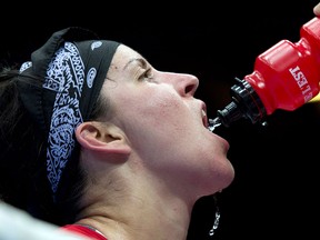 Windsor's Mary Spencer drinks some water after losing 17-14 against China's Jinzi Li during their 68-75kg women's quarterfinal bout at the 2012 Summer Olympics in London. (The Canadian Press/Ryan Remiorz)