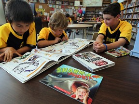 Students Nakona Goodwin, left, Nick Fox and Colton Kehoe participate in the Wise Guys Read program, Monday June 18, 2012.    (NICK BRANCACCIO/The Windsor Star)