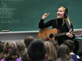 St. John Vianney students and staff welcomed Windsor-born singer-songwriter Julie Kryk to their school Tuesday, Dec. 4, 2012.  Kryk, shown during the process, worked with the students to compose a school song.  (DAN JANISSE/The Windsor Star)